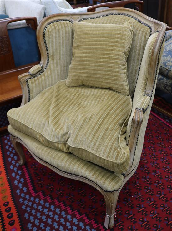 A Louis XV style beech bergere chair